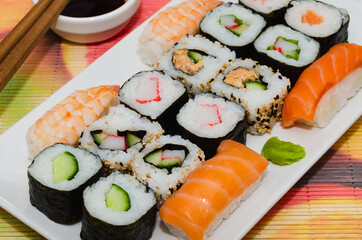 Sushi traditional japanese food. Sushi plate with soy sauce and chopsticks