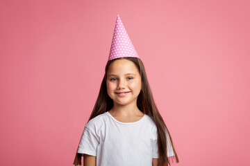 Happy birthday. Smiling little girl in cap and white t-shirt