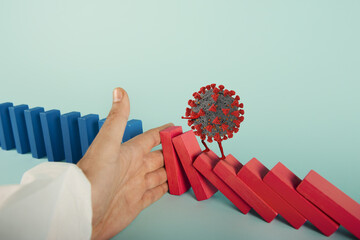 Concept of covid19 coronavirus pandemic with falling chain like a domino game. Contagion and...