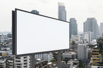 Blank white road billboard with Bangkok cityscape background at day time. Street advertising poster, mock up, 3D rendering. Side view. The concept of marketing communication to promote or sell idea.