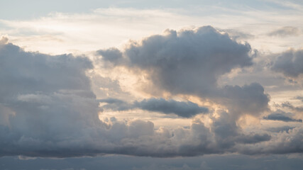 Evening sky with clouds and warm sun light