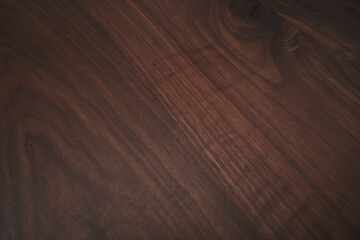 Closeup toned black walnut surface with oil finish