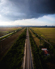 Fototapeta na wymiar Railway track heading into the horizon in Kodiang, Malaysia