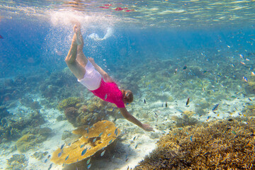 Child snorkeling. Kids underwater. Beach and sea.
