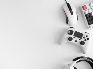 gamer work space concept, top view a gaming gear, mouse, keyboard, joystick and headset. © ekkaphan