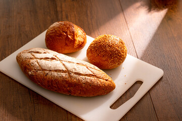 Fresh bread on wooden table for breakfast