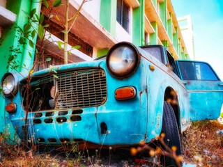 Abandoned premium old rusty car.