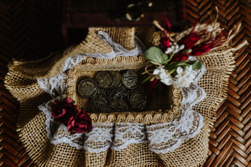 jewelry box on a table. box with the 13 coins necessary for a celebration of Christian marriage