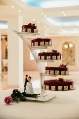 wedding cake in a restaurant. wedding cake dolls of various heights