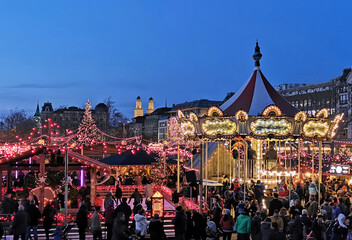 Christmas market, fair and colourful carousel in the old town for christmas.