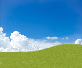 green field with cloud and blue sky background 