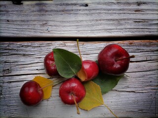 red apples on a wooden table