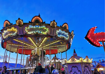 Christmas market, fair and colourful carousel in the old town for christmas.