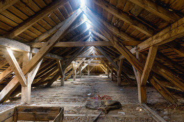 Fototapeta na wymiar The attic of an old ruined house