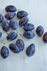 fresh plums on a wooden table