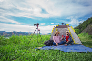 Shot of a happy couple camping on the nature.