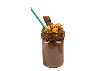 Chocolate milkshake with whipped cream, cookies, waffles, served in glass mason jar. "Freak or crazy" sweet shake. Isolated.