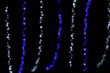 Bokeh on a black background. Colored lights