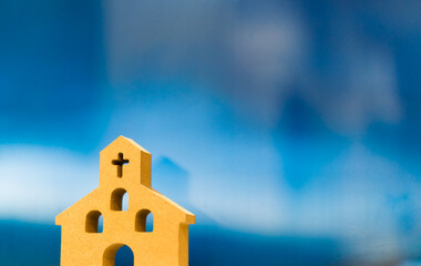 Wooden Church on blue background.Christianity, Catholic, Cross and Jesus christ.Worship and Praise...