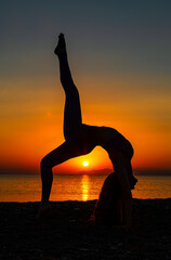 Yoga asanas and sunset 