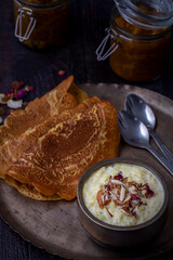 Kheer and besan puda, traditional punjabi foods served in traditional utensils