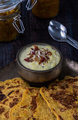 Kheer and besan puda, traditional punjabi foods served in traditional utensils
