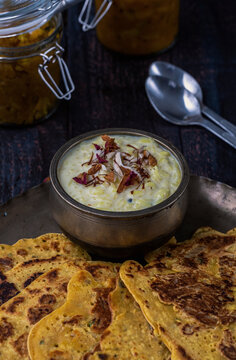 Kheer and besan puda, traditional punjabi foods served in traditional utensils