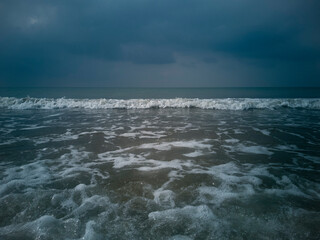 Summer days. Foamy waves of the transparent sea. Warm.