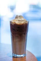 Iced coffee with whipped cream and sprinkle with almonds
