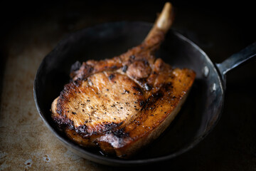 huge rustic pan fried pork chop