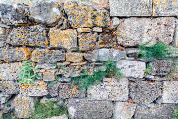 Stone tiles wall texture rock texture history construction archaeological exploration.  Ancient background decorative design marble mineral material. Old rock textured stone pattern wallpaper surface