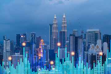 Stock market graph hologram, night panorama city view of Kuala Lumpur. KL is popular location to gain financial education in Malaysia, Asia. The concept of international research. Double exposure.