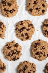 Pattaern of cookies on white parchment paper