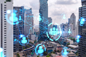 Social media icons hologram over panorama city view of Bangkok, Asia. The concept of people networking and connections. Double exposure.