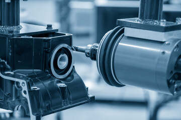 The milling spindle attached on the robotic arm for finishing cur the gearbox parts. The automatic...