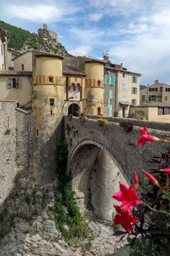 Arched stone bridge over the River Var from the entrance to the French medieval town of Entrevaux, Provence-Alpes-Côte d'Azur region, Alpes de Haute Provence, France