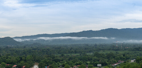 Fototapeta na wymiar Fog caused by the integrity of the forest after the rain. Nakhon Nayok, Thailand. The environment.