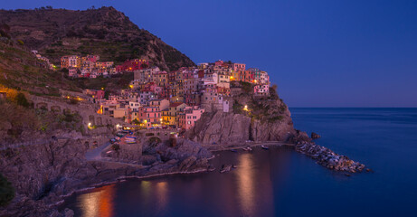 Majestic blue hour view of Manarola in Cinque Terre, Italy