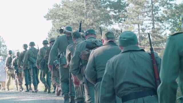 German soldiers from world war 2 walking on foot 4K. Filmed with the cooperation of Kulturno zgodovinsko Drustvo Triglav from Slovenia 