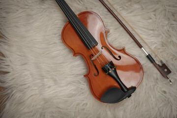 Fototapeta na wymiar Violin put on background,show detail of acoustic instrument