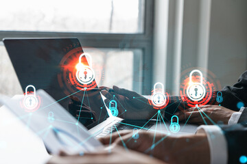 Man and woman working together on securitization of information of project. Blue icon infographic lock hologram. Concept of datum safety. Double exposure.
