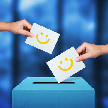 Woman hands putting smile face card into feedback box. Service rating, satisfaction concept
