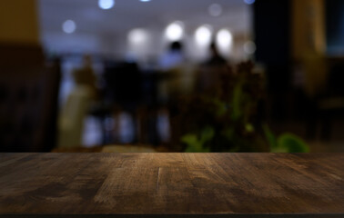 Wood Table Top in Blur Background room interior with empty copy space.