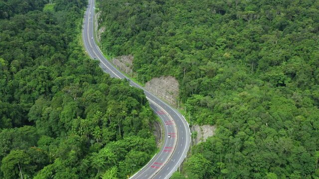 Footage 4k B-roll Aerial drone view of Southern Thailand Road with green jungle in Thailand.