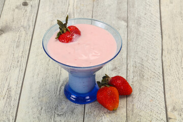 Yoghurt with strawberry in the bowl