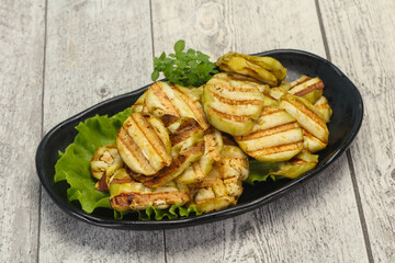 Grilled eggplant slices served basil