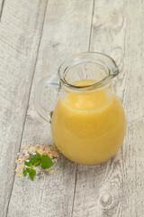 Dietary vegetarian oats milk over wooden
