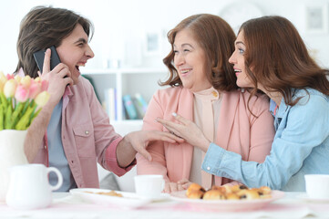 Happy family of three spending time together at dinner 