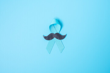 November Prostate Cancer Awareness month, light Blue Ribbon with mustache for supporting people living and illness. Healthcare, International men, Father and World cancer day concept