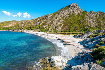 Fototapeta na wymiar Corsica beach with turquoise sea and paradise beach. Saint Florent Corsica France.